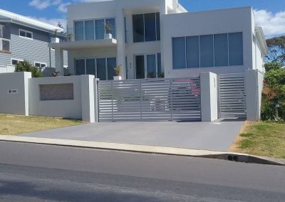 Light grey Automated Gate to Two Storey House in the Shoalhaven